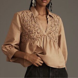 Anthropologie Maeve Smocked Babydoll Top Blouse in a tan color